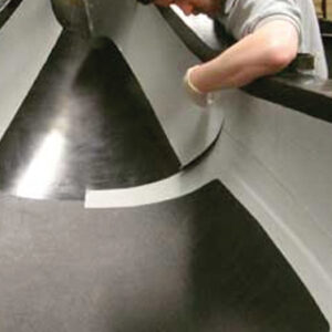 man laying carbon fibre sheet for composite applications