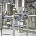 pneumatic conveying two metal hopper tanks signifying pneumatic conveying applications